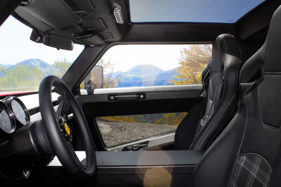 Brawley cabin with steering wheel, gauges, and embossed seat backs